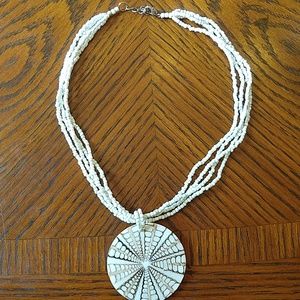 Beaded necklace with shell decoration
